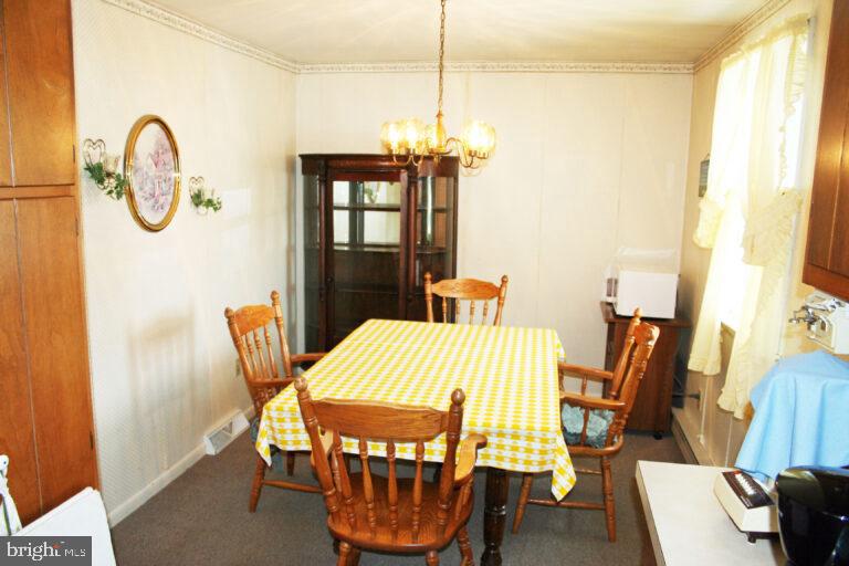 2049 Robin Drive Manheim, PA 17545 - Photo 14 of 25 a view of a dining room with furniture and a window