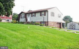 2049 Robin Drive Manheim, PA 17545 - Photo 2 of 25 a front view of a house with a yard and trees