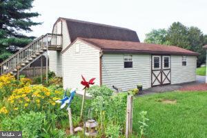 2049 Robin Drive Manheim, PA 17545 - Photo 8 of 25 a front view of a house with a yard and potted plants