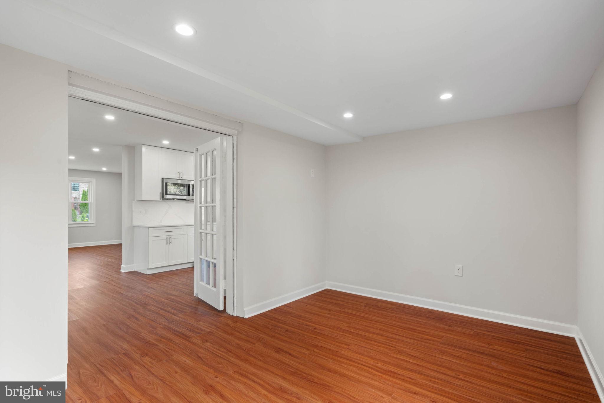 6607 Edsall Road Springfield, VA 22151 - Photo 12 of 47 a view of a kitchen with wooden floor and a sink