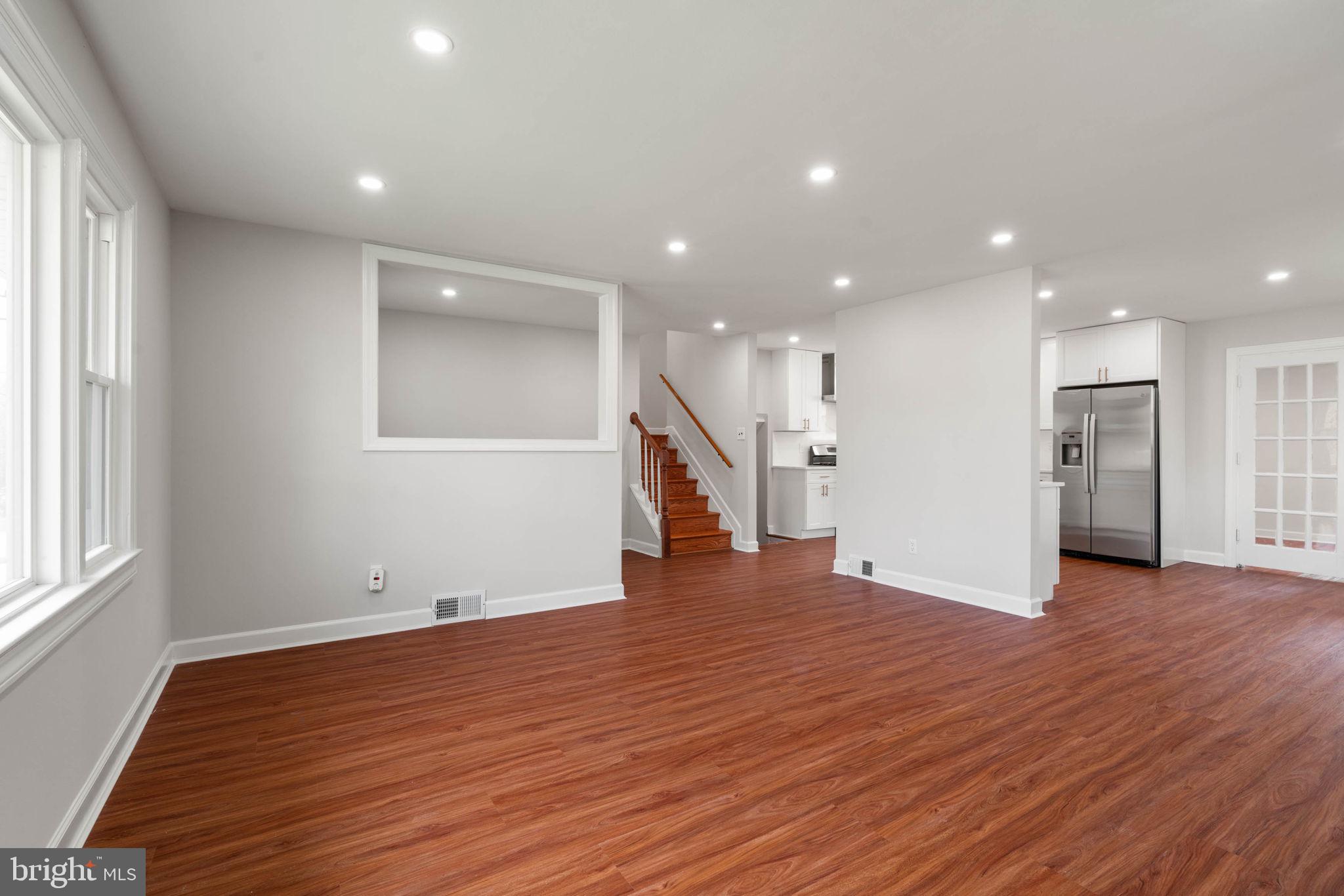 6607 Edsall Road Springfield, VA 22151 - Photo 15 of 47 a view of empty room with wooden floor and windows
