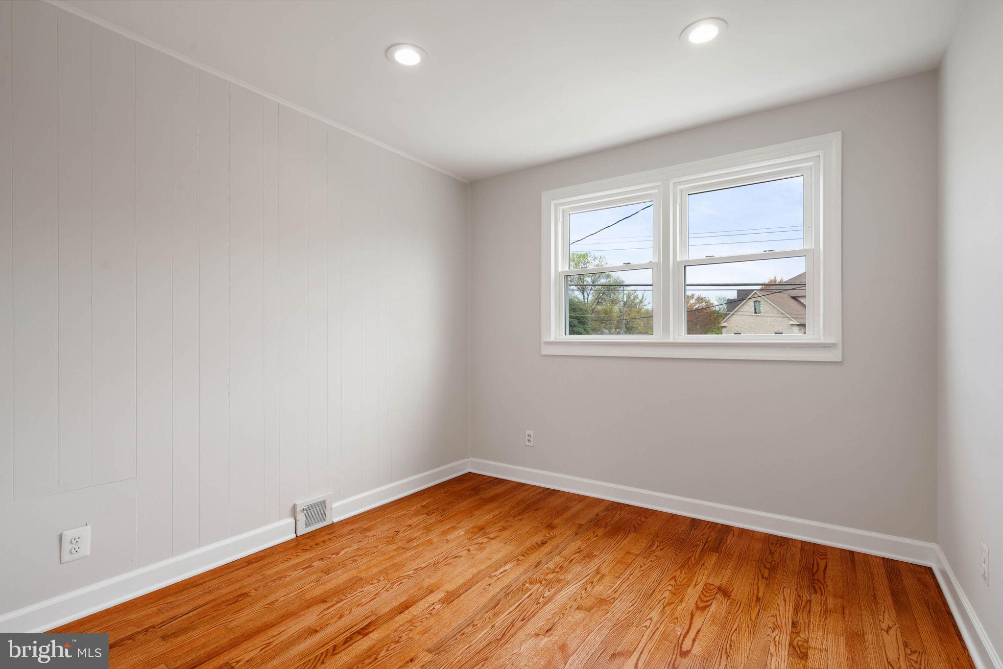6607 Edsall Road Springfield, VA 22151 - Photo 22 of 47 a view of empty room with wooden floor and fan