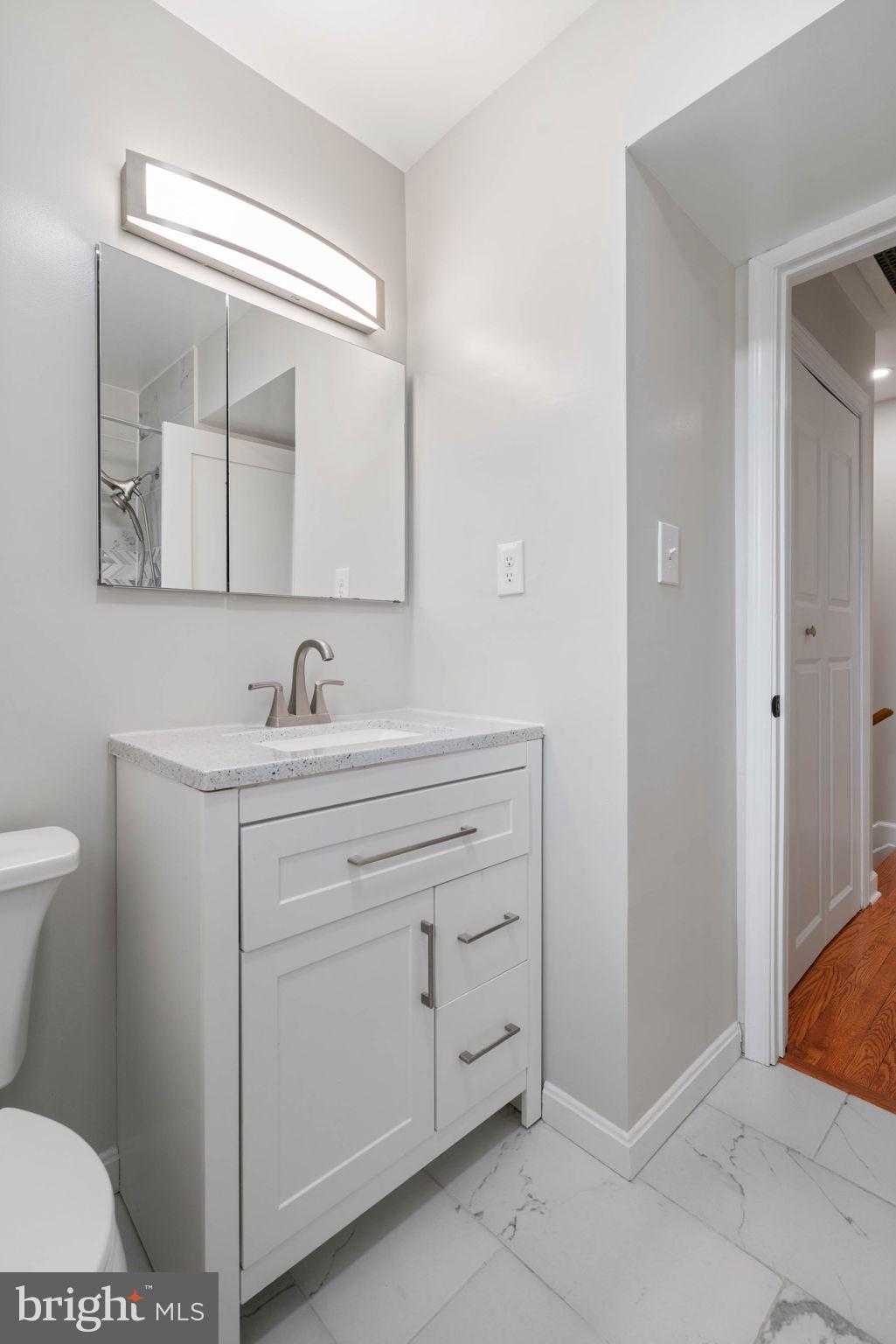 6607 Edsall Road Springfield, VA 22151 - Photo 29 of 47 a bathroom with a sink and a mirror