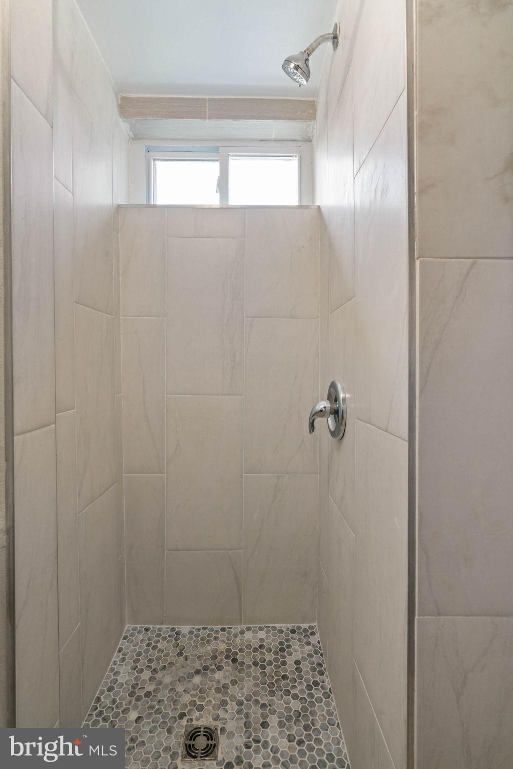 6607 Edsall Road Springfield, VA 22151 - Photo 36 of 47 a bathroom with a shower