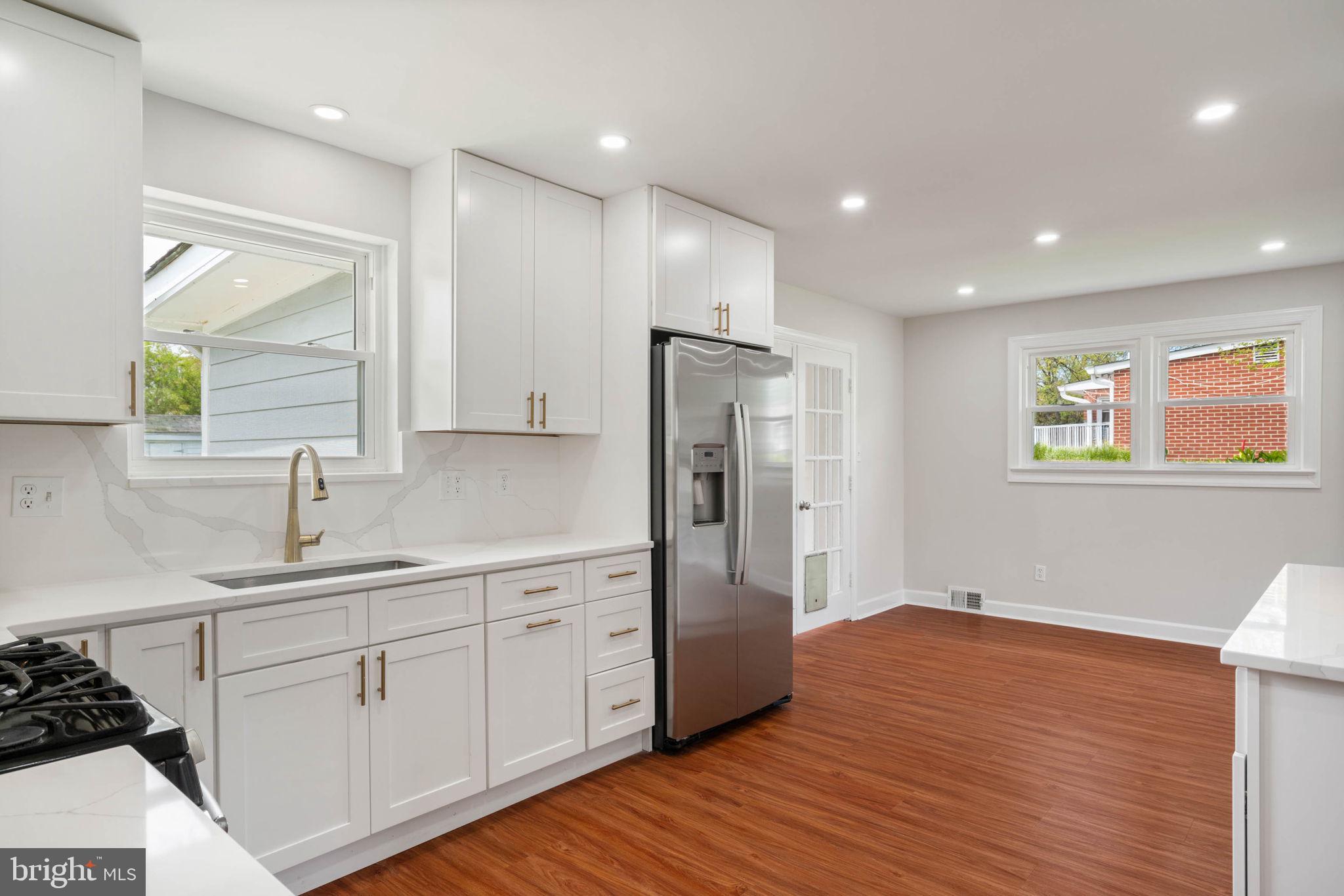 6607 Edsall Road Springfield, VA 22151 - Photo 6 of 47 a kitchen with stainless steel appliances granite countertop a refrigerator and a sink
