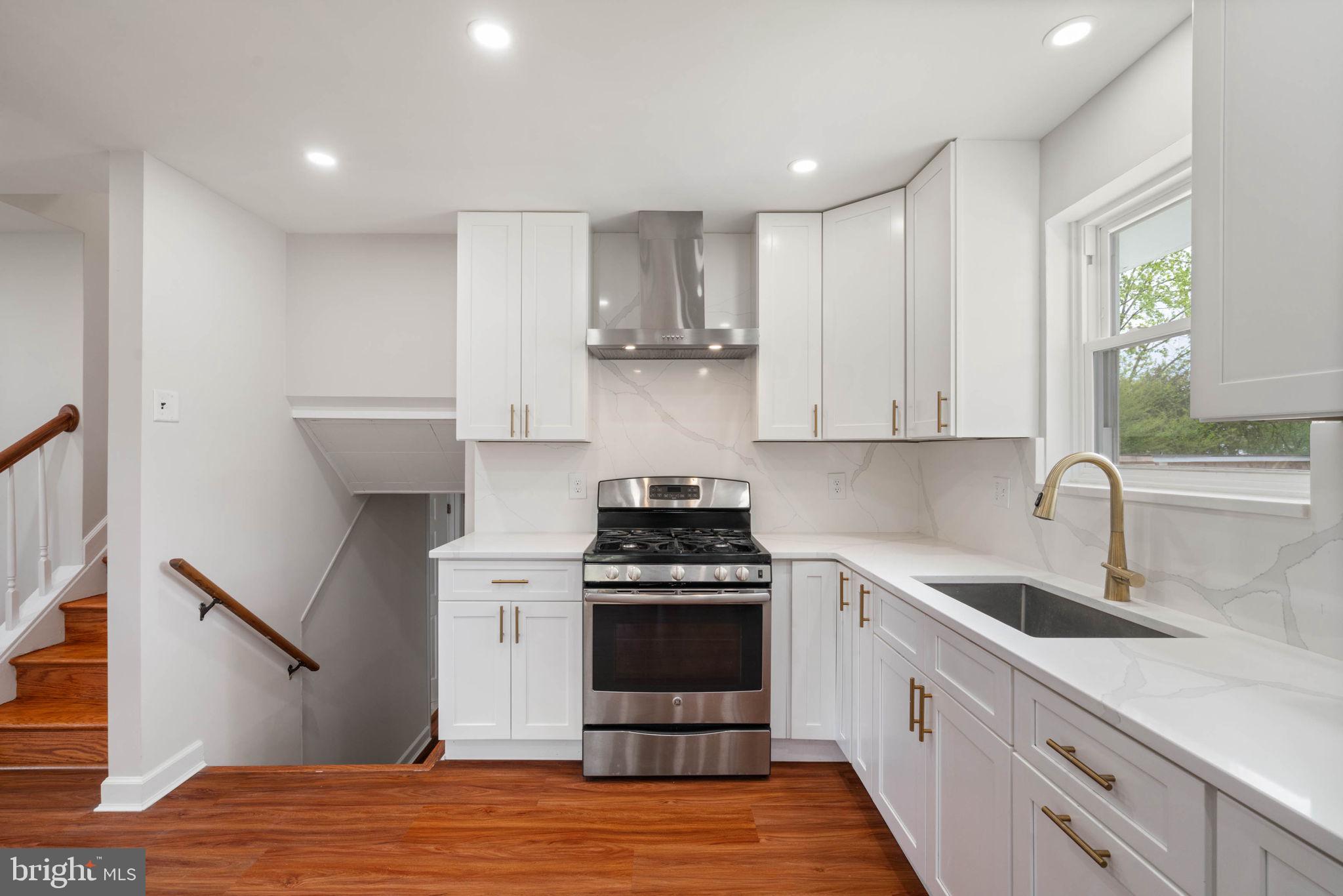 6607 Edsall Road Springfield, VA 22151 - Photo 7 of 47 a kitchen with a stove and a sink