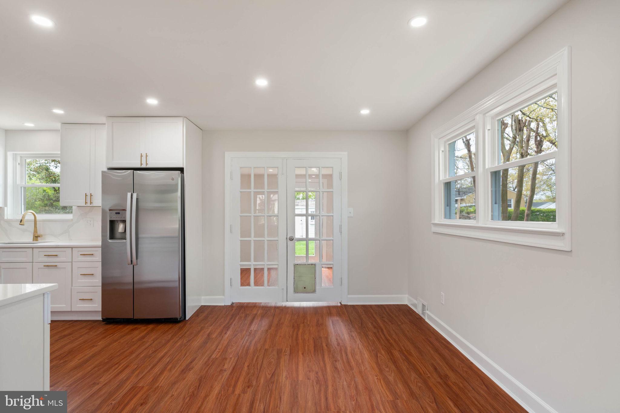 6607 Edsall Road Springfield, VA 22151 - Photo 9 of 47 a view of an empty room with wooden floor and a window