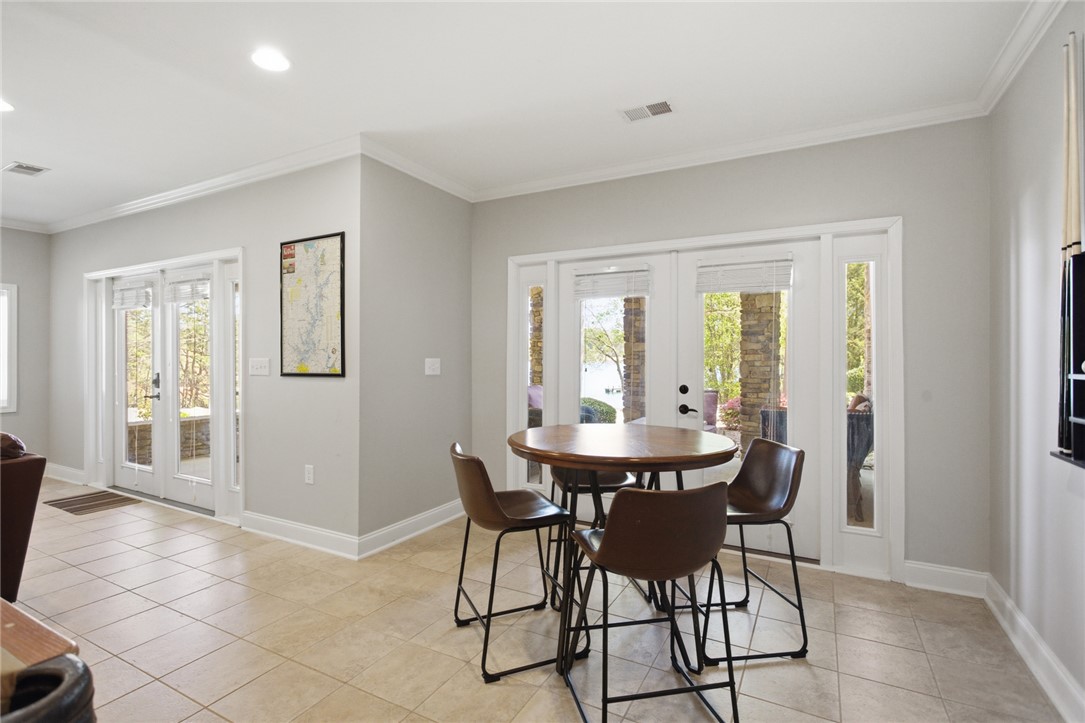 578 Sunset Point Drive West Union, SC 29696 - Photo 34 of 46 This bright space offers dual French doors and durable tile flooring, creating an inviting atmosphere.