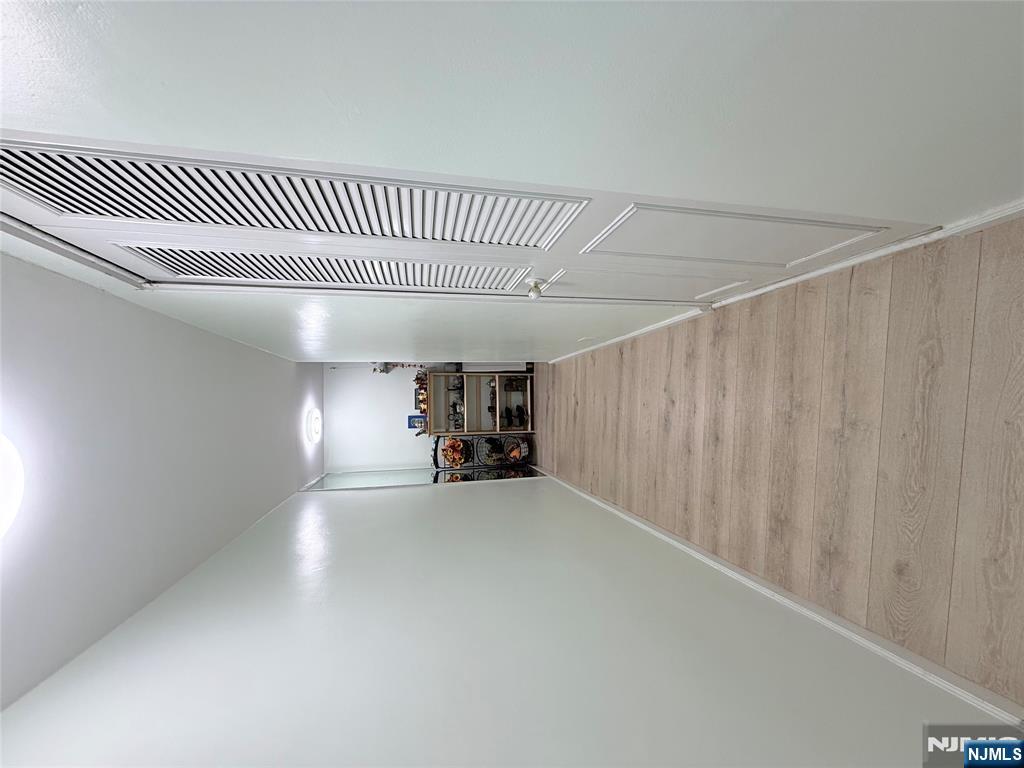 265 Main Street, Unit 113 Ridgefield Park, NJ 07660 - Photo 3 of 13 a view of a bedroom with wooden floor