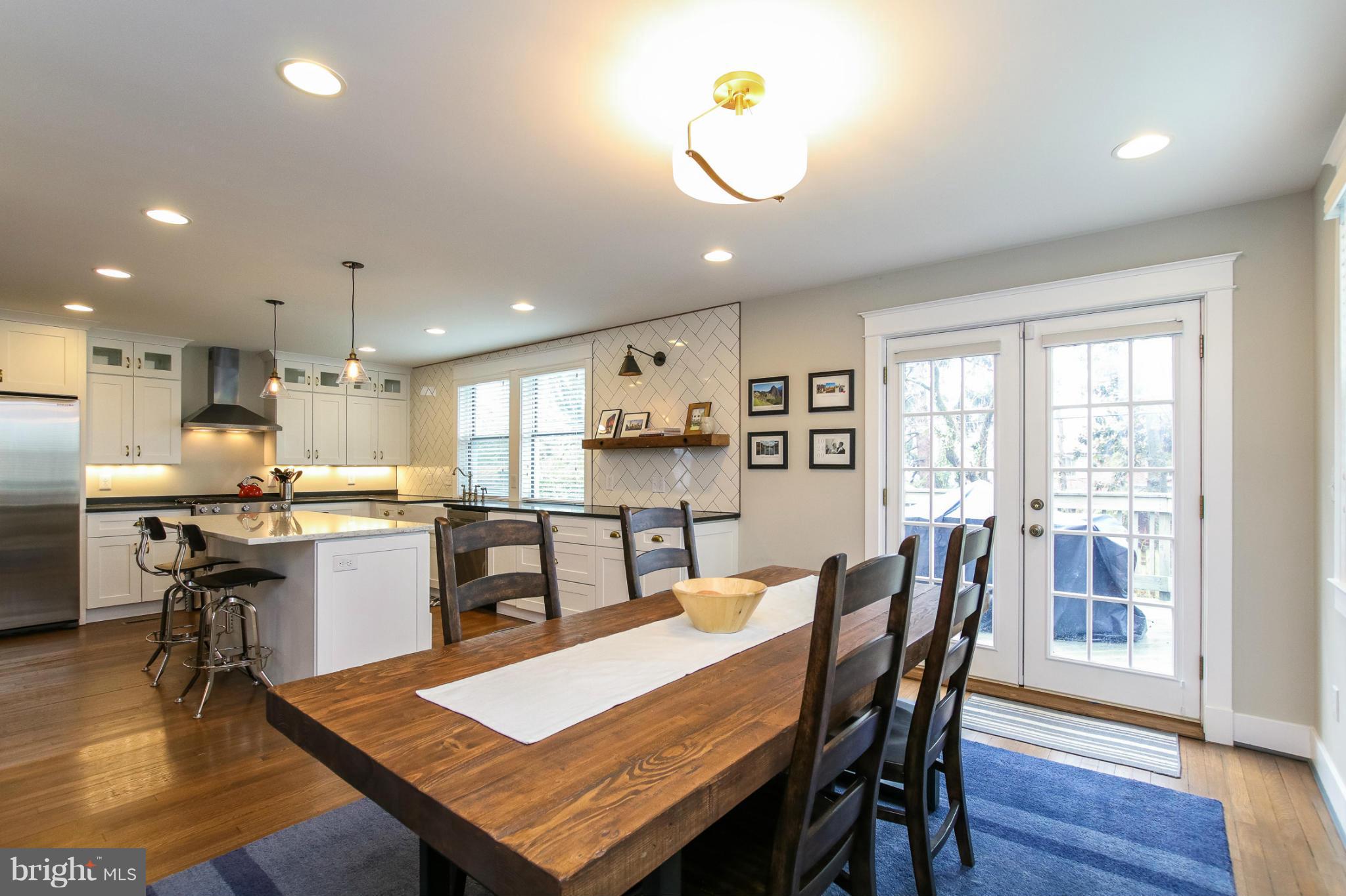 829 Kingston Road Baltimore, MD 21212 - Photo 13 of 30 a kitchen with a table and chairs in it