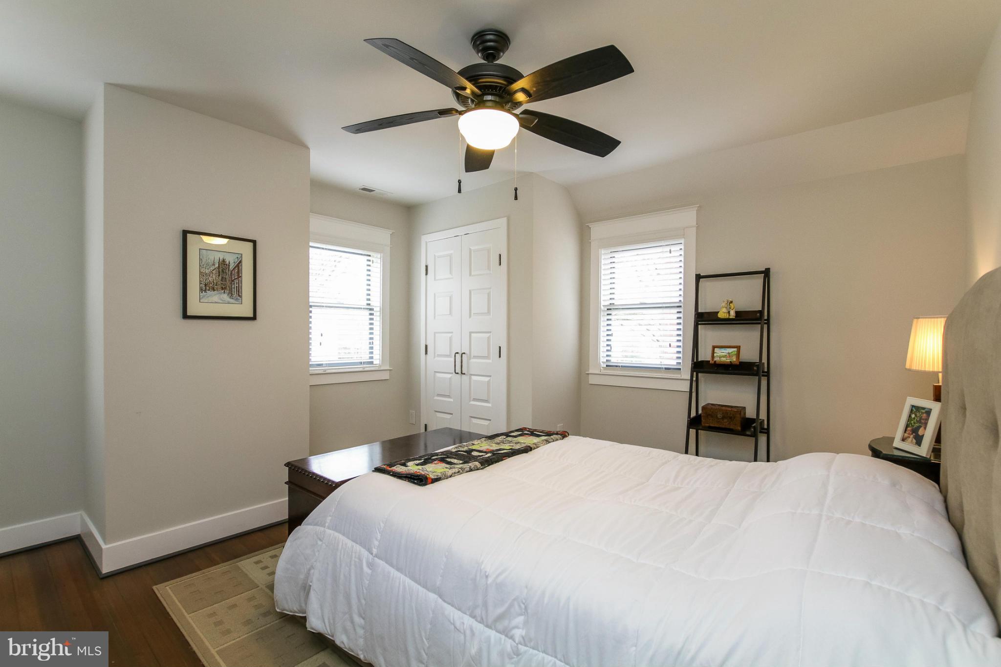829 Kingston Road Baltimore, MD 21212 - Photo 15 of 30 a bedroom with a bed and a chandelier