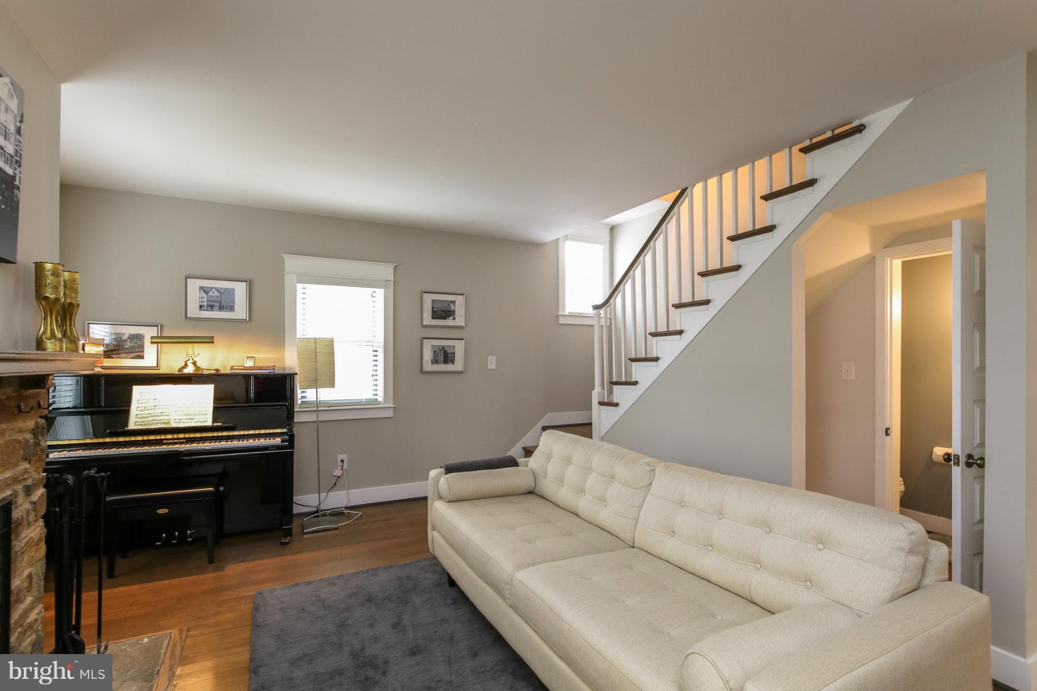 829 Kingston Road Baltimore, MD 21212 - Photo 5 of 30 a living room with furniture and a piano