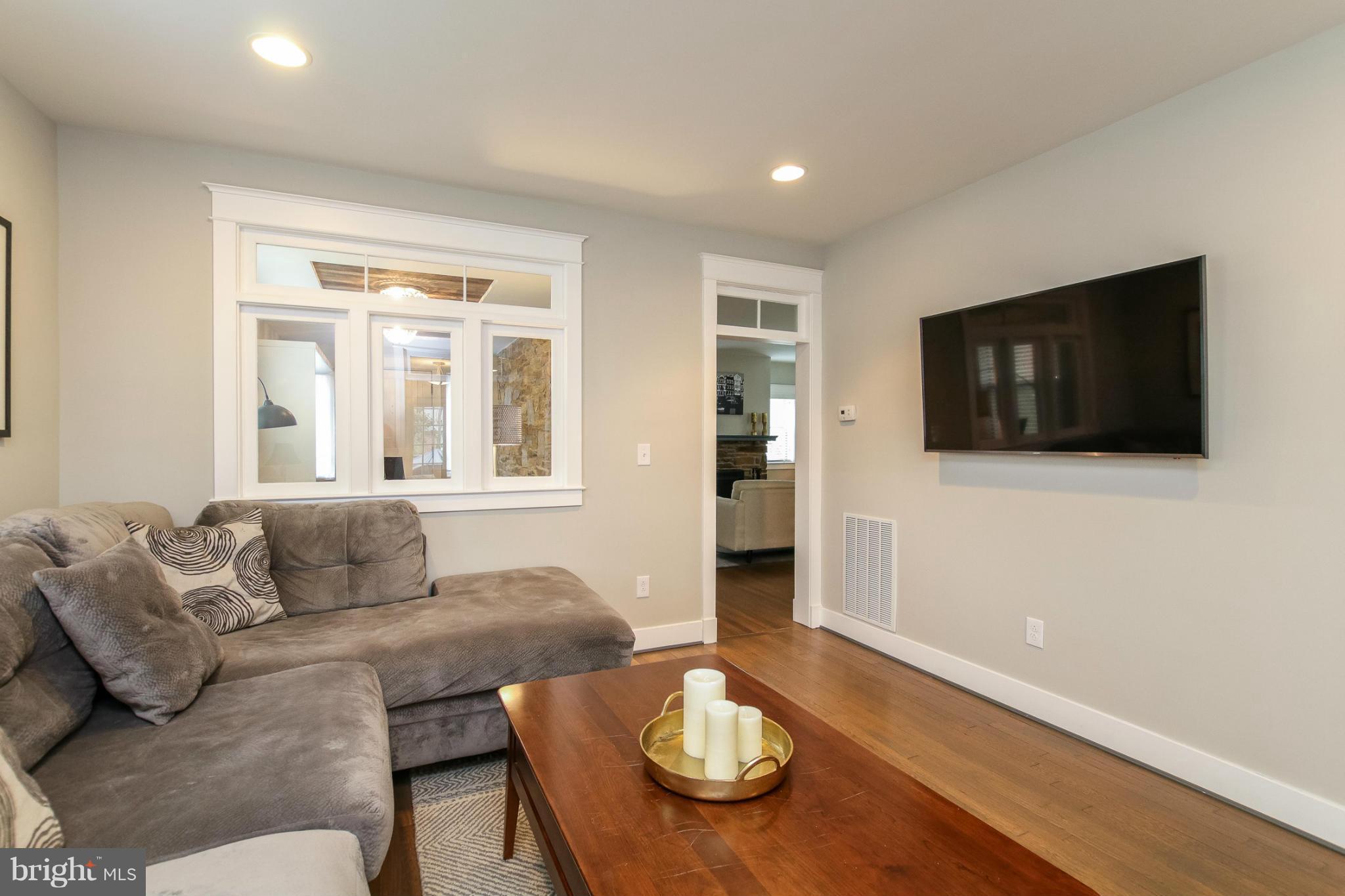829 Kingston Road Baltimore, MD 21212 - Photo 7 of 30 a living room with furniture and a flat screen tv
