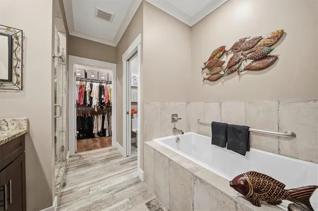 a bathroom with a tub and a sink