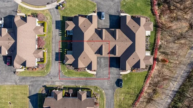 an aerial view of residential building and outdoor space