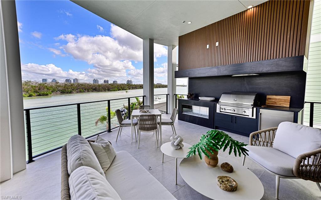 26415 Bay Road Bonita Springs, FL 34134 - Photo 3 of 42 a living room with furniture and a floor to ceiling window