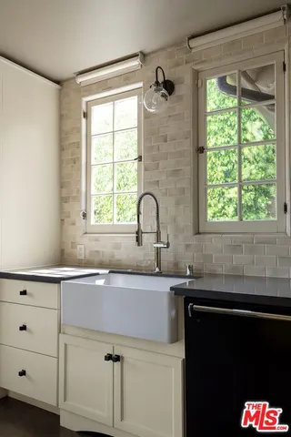a kitchen with a sink and a window