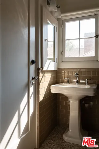 a view of wooden floor and windows in a room