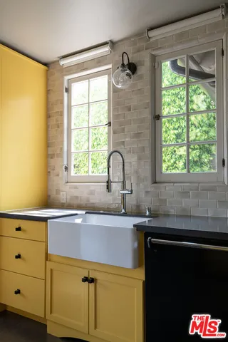 a view of a room with wooden floor and windows