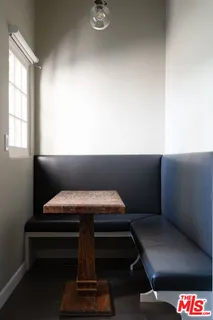 a view of wooden floor and windows in a room