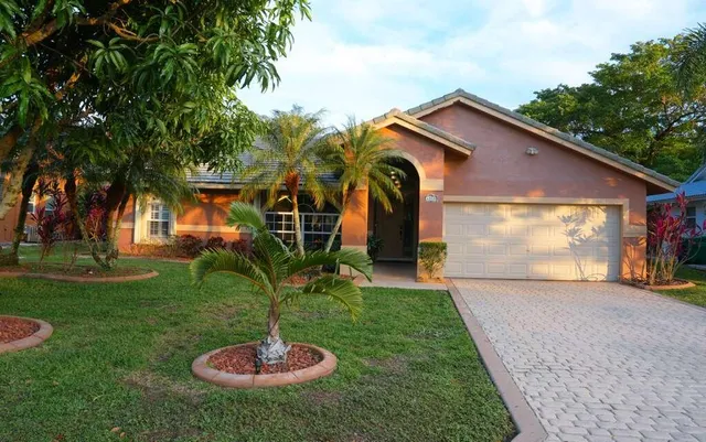 a view of a a dining room with furniture window and wooden floor