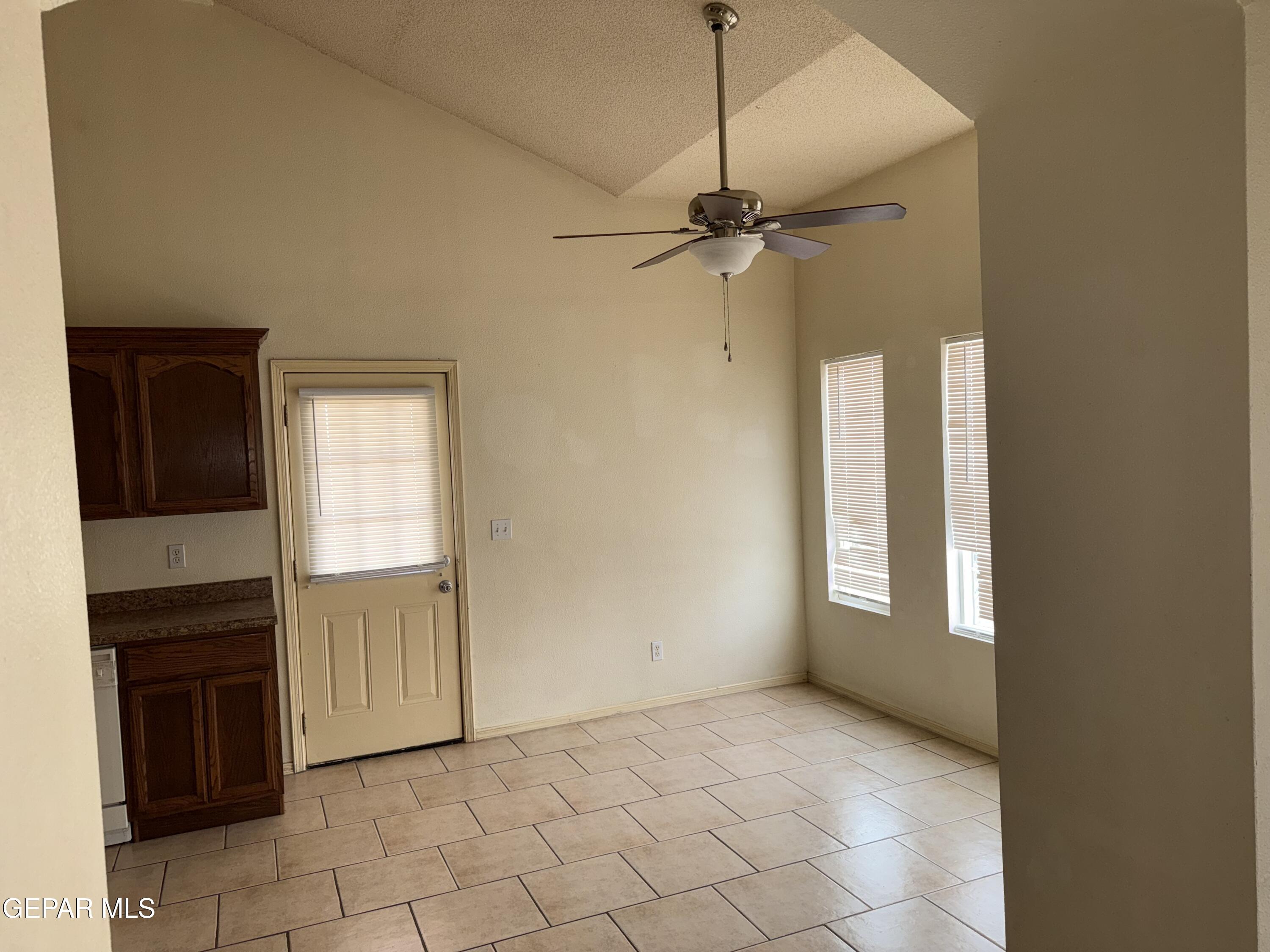 456 Passmore Road Socorro, TX 79927 - Photo 5 of 23 a view of an empty room with a fireplace and a window