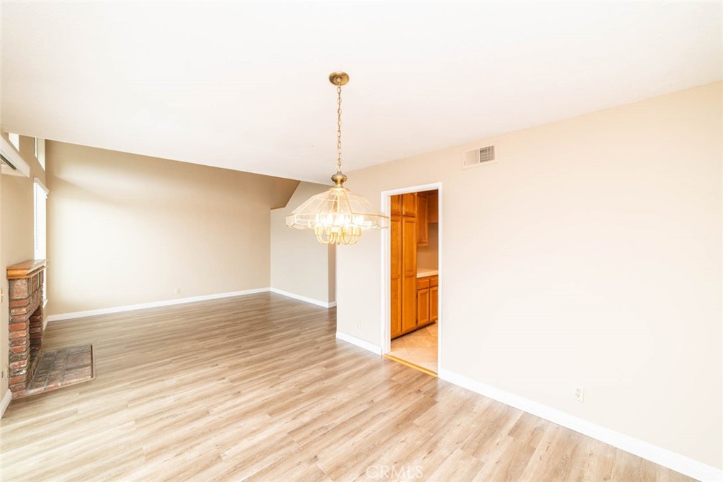 25 Parkman Road East Laguna Niguel, CA 92677 - Photo 11 of 36 a view of a room with wooden floor and a window