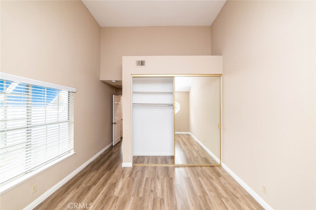 25 Parkman Road East Laguna Niguel, CA 92677 - Photo 18 of 36 a view of an empty room with wooden floor and a window