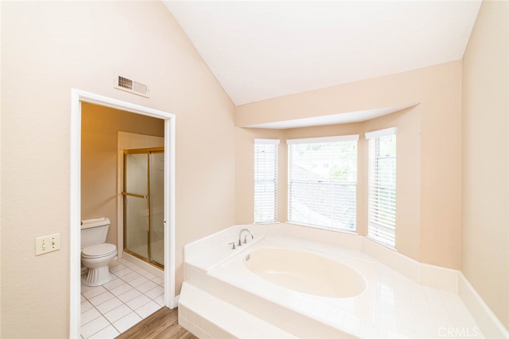25 Parkman Road East Laguna Niguel, CA 92677 - Photo 24 of 36 a spacious bathroom with a bathtub and a toilet