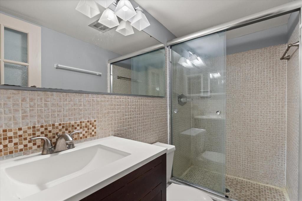 2500 Lee Road, Unit 208 Winter Park, FL 32789 - Photo 16 of 49 a bathroom with a sink and a mirror