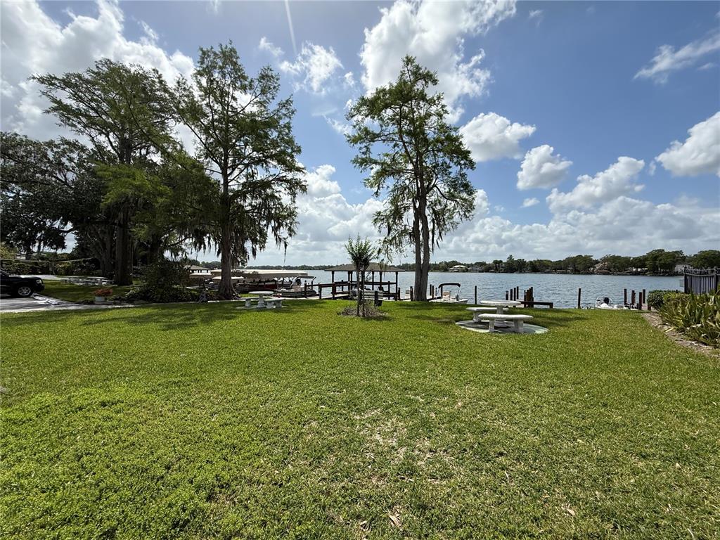 2500 Lee Road, Unit 208 Winter Park, FL 32789 - Photo 29 of 49 a view of yard with swimming pool and trees