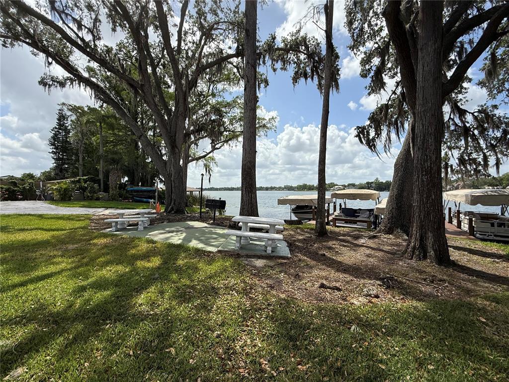 2500 Lee Road, Unit 208 Winter Park, FL 32789 - Photo 30 of 49 a view of a lake with houses