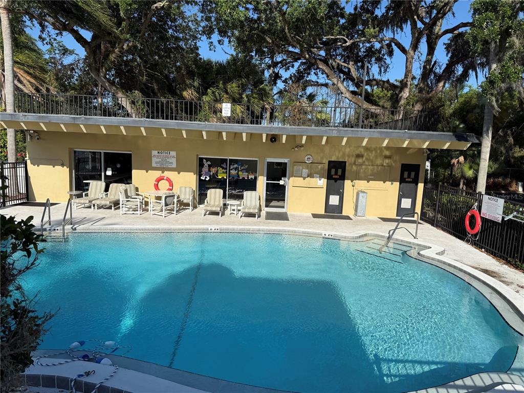 2500 Lee Road, Unit 208 Winter Park, FL 32789 - Photo 3 of 49 a view of a swimming pool with an outdoor seating