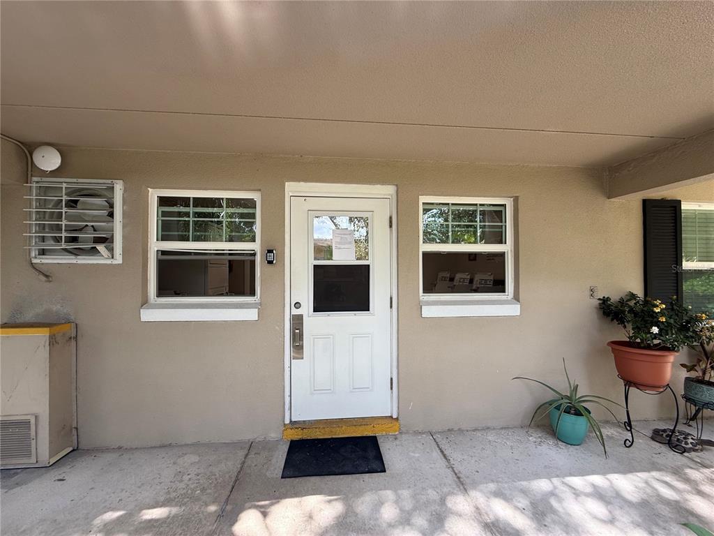 2500 Lee Road, Unit 208 Winter Park, FL 32789 - Photo 34 of 49 a living room with furniture and flowers