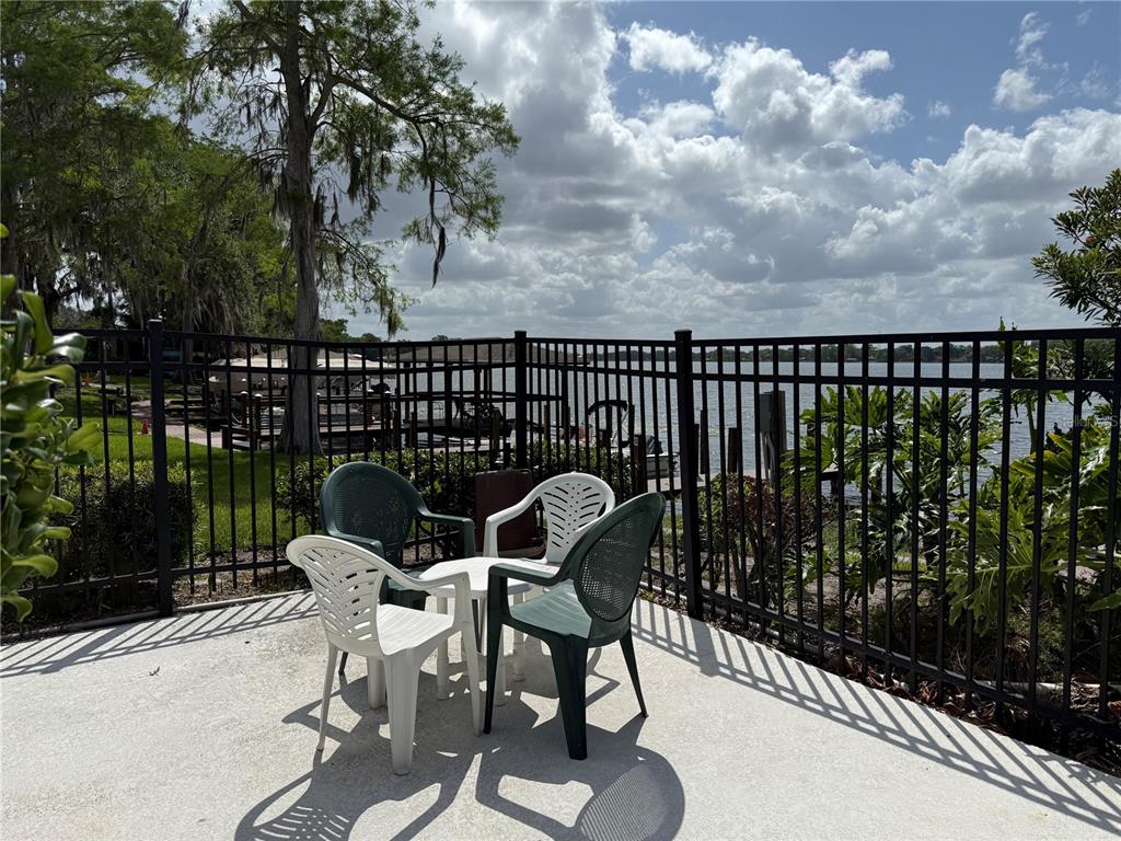 2500 Lee Road, Unit 208 Winter Park, FL 32789 - Photo 40 of 49 a balcony with table and chairs