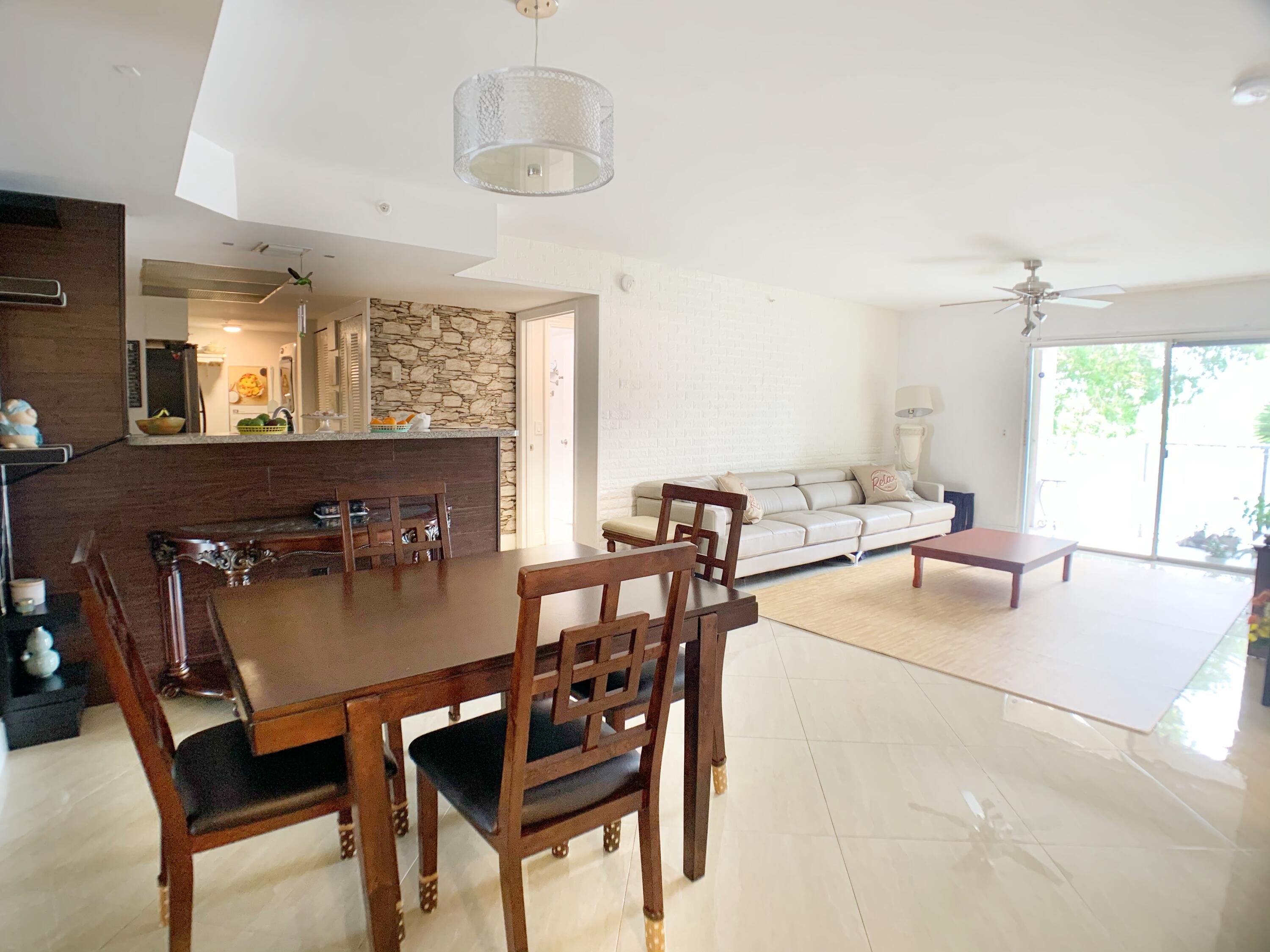 5015 Wiles Road, Unit 206 Coconut Creek, FL 33073 - Photo 9 of 32 a dining room with furniture and window