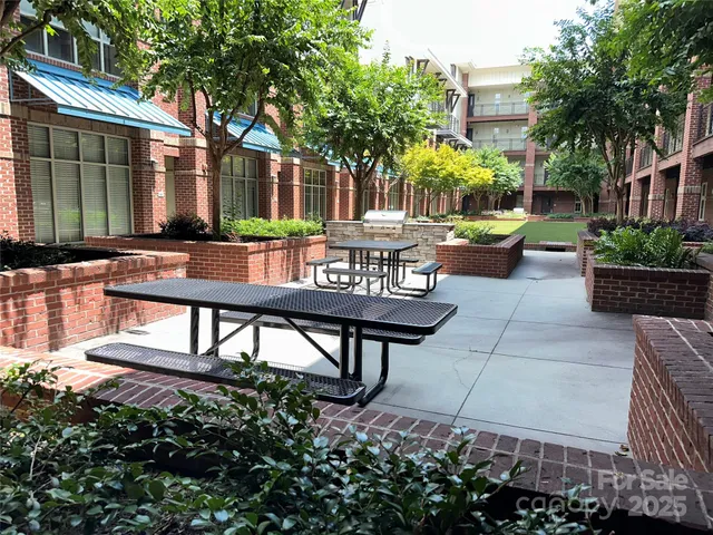 a view of a chairs and table in backyard of the house