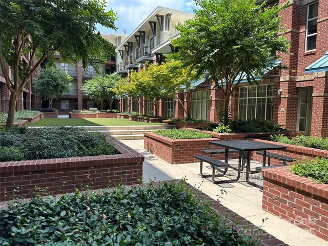 a view of a backyard with sitting area