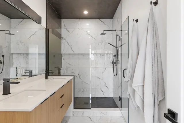 a bathroom with a sink and shower