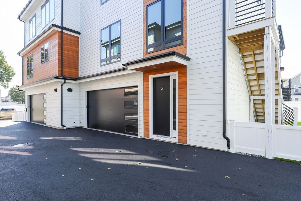 31 Hall Street, Unit 2 Waltham, MA 02453 - Photo 18 of 23 a view of a house with a street