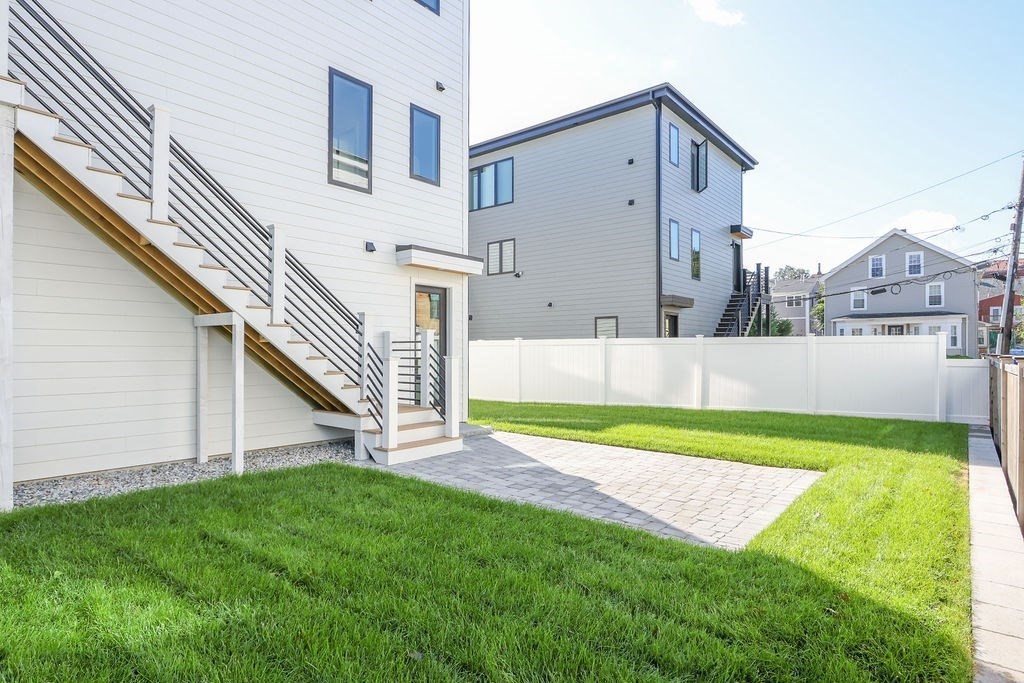 31 Hall Street, Unit 2 Waltham, MA 02453 - Photo 23 of 23 a view of a back yard of the house