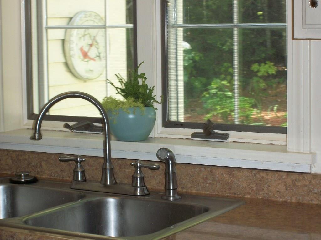 4 Azalea Lane, Unit 2 Windham, ME 04062 - Photo 13 of 33 Kitchen overlooks the lovely back yard.