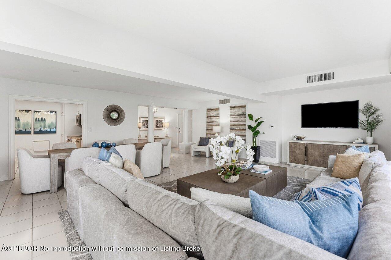 44 Cocoanut Row, Unit 120B Palm Beach, FL 33480 - Photo 11 of 42 a living room with furniture and a flat screen tv