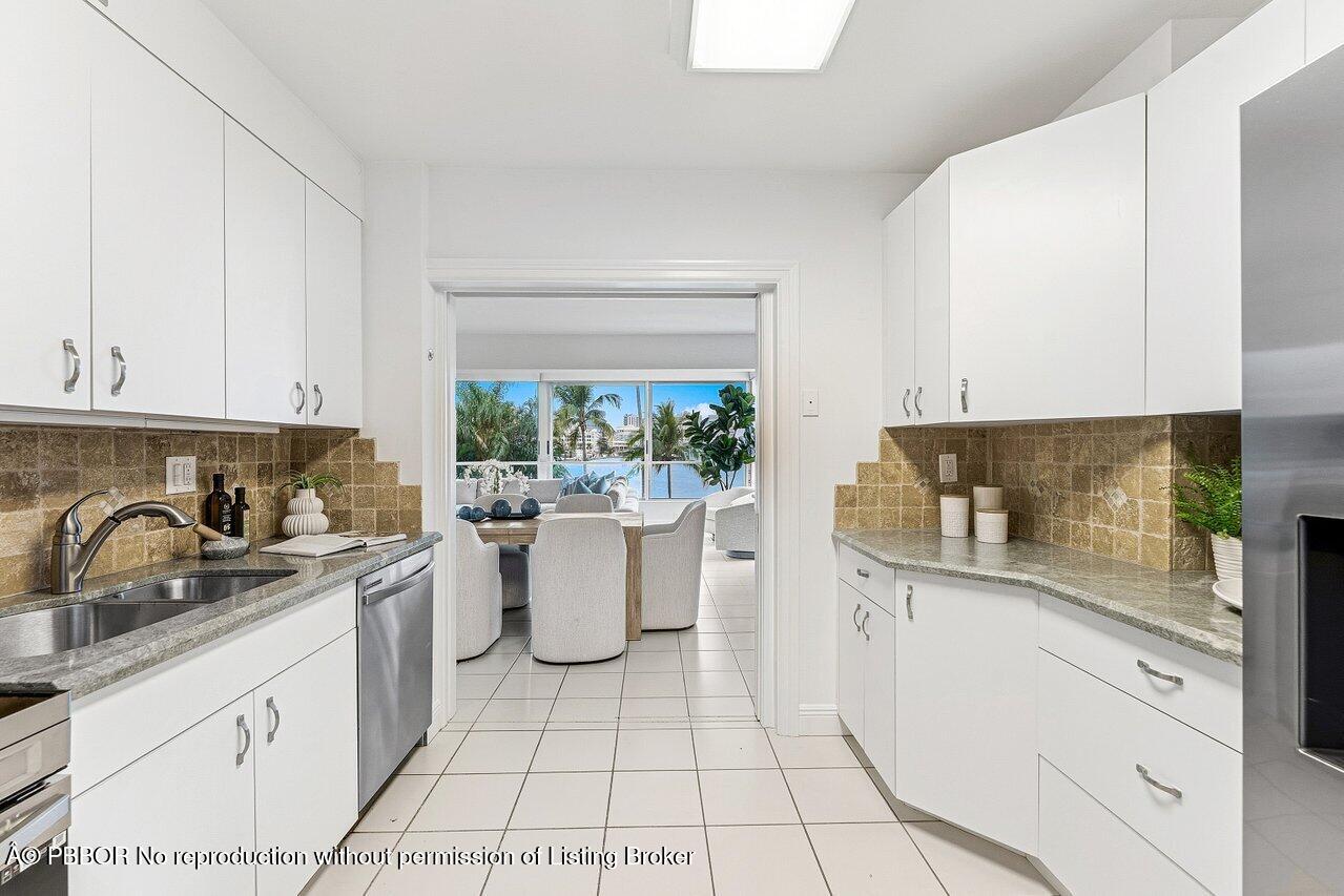 44 Cocoanut Row, Unit 120B Palm Beach, FL 33480 - Photo 14 of 42 a kitchen with a sink and cabinets