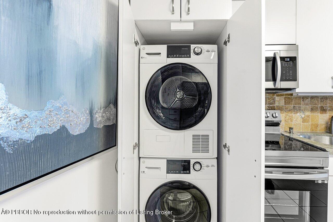 44 Cocoanut Row, Unit 120B Palm Beach, FL 33480 - Photo 16 of 42 a view of a hallway with washer and dryer