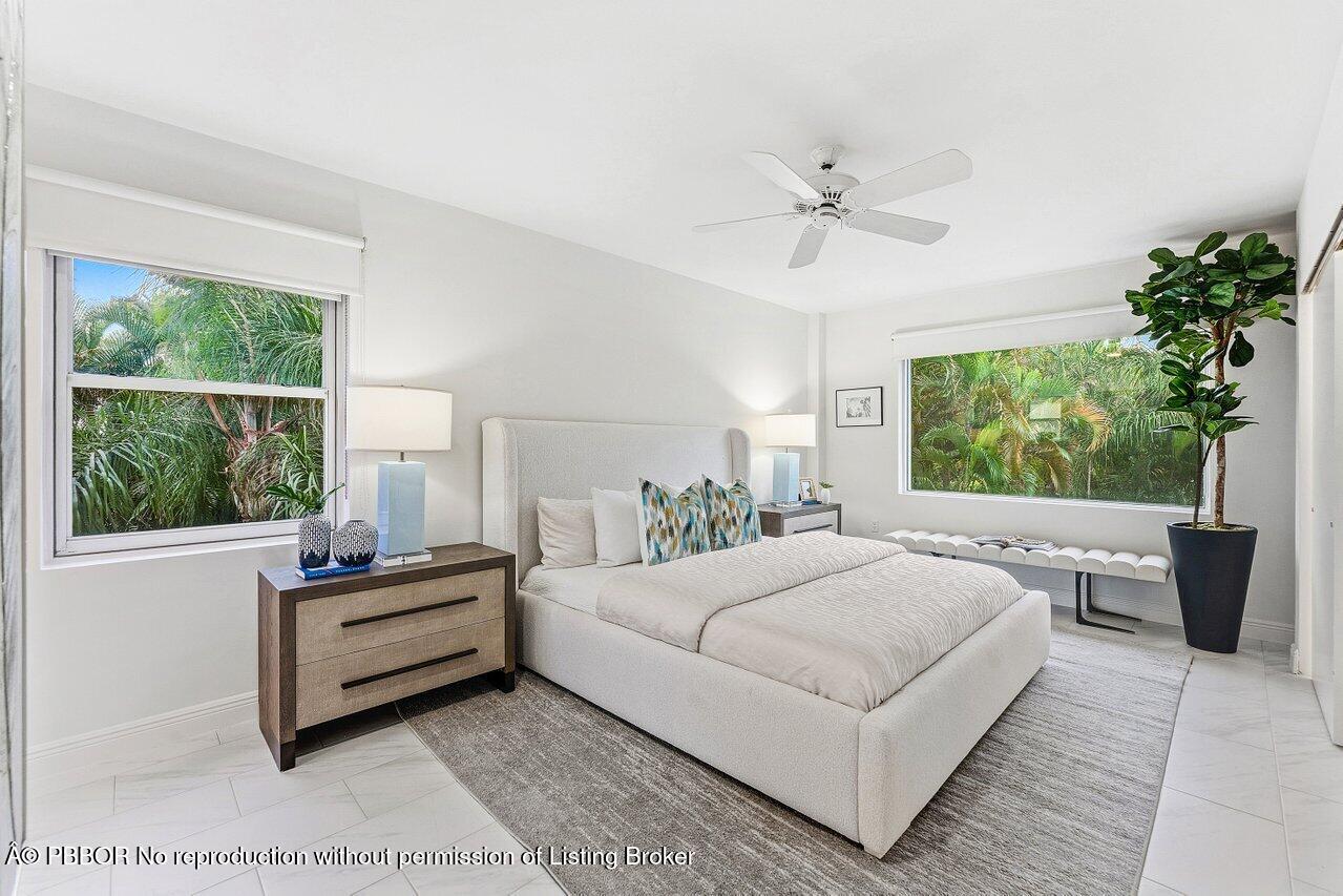 44 Cocoanut Row, Unit 120B Palm Beach, FL 33480 - Photo 17 of 42 a bedroom with a large bed and a window