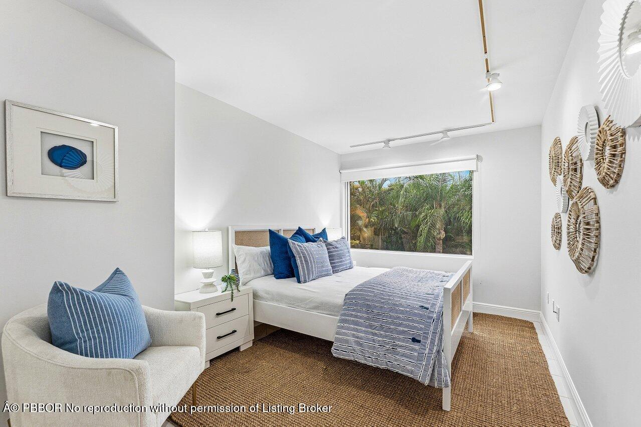 44 Cocoanut Row, Unit 120B Palm Beach, FL 33480 - Photo 23 of 42 a bedroom with a bed and a window