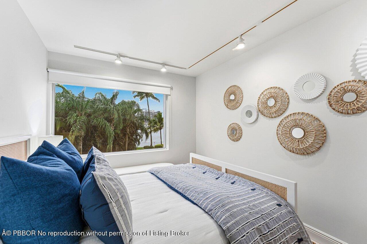 44 Cocoanut Row, Unit 120B Palm Beach, FL 33480 - Photo 24 of 42 a bedroom with a bed and a window