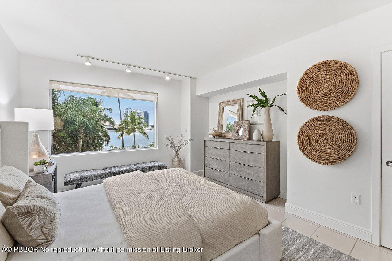 44 Cocoanut Row, Unit 120B Palm Beach, FL 33480 - Photo 27 of 42 a bedroom with a large bed and a window