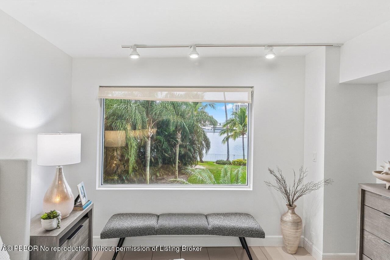 44 Cocoanut Row, Unit 120B Palm Beach, FL 33480 - Photo 28 of 42 a living room with furniture and a window